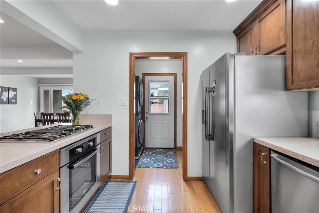 22643 Draille Drive Torrance, CA 90505 - Photo 7 of 33 a kitchen with stainless steel appliances granite countertop a refrigerator and a stove