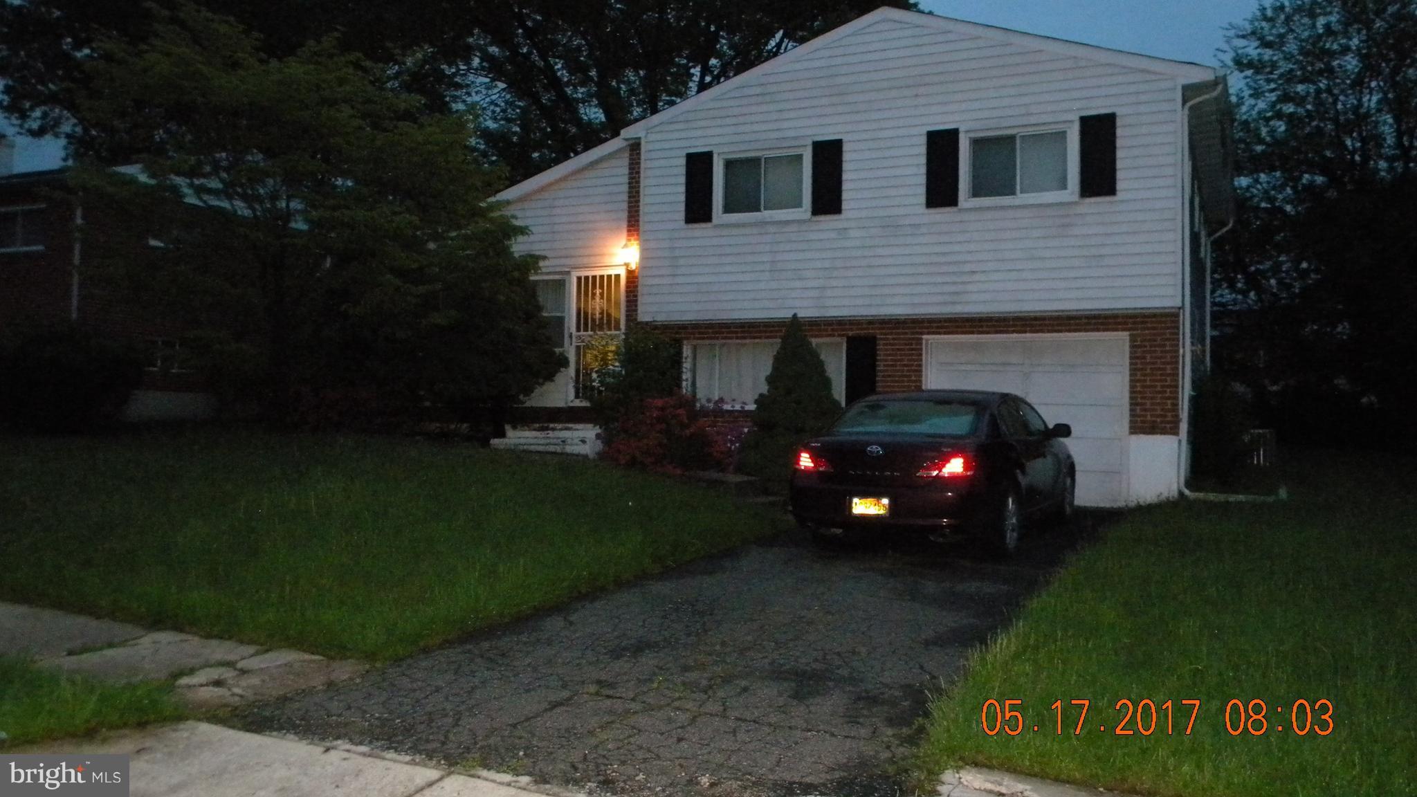 917 Prestwood Road Baltimore, MD 21228 - Photo 1 of 18 a view of a house with a garden