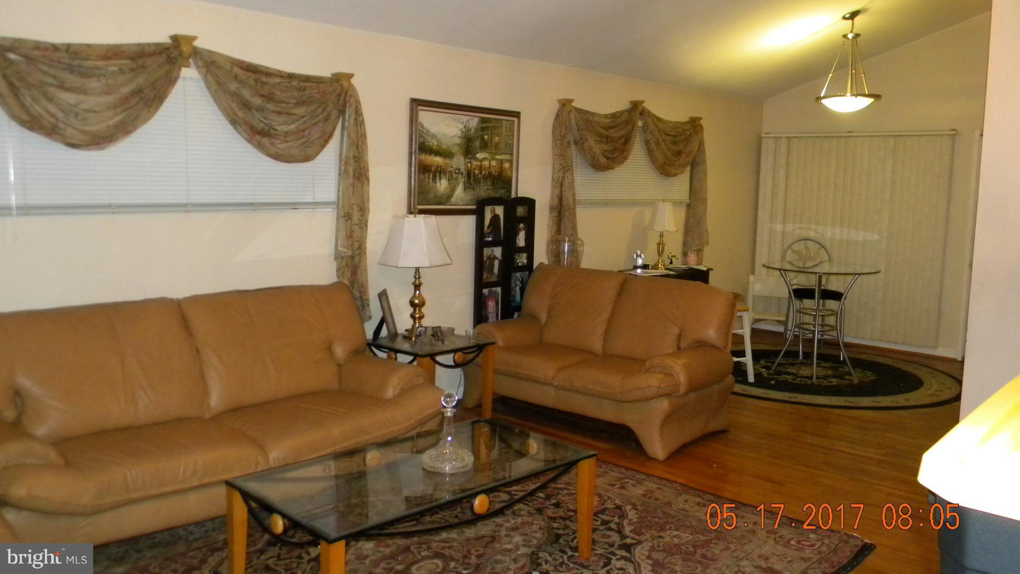 917 Prestwood Road Baltimore, MD 21228 - Photo 3 of 18 a living room with furniture and wooden floor