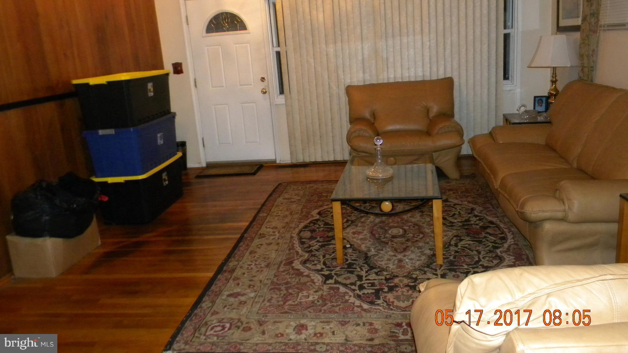 917 Prestwood Road Baltimore, MD 21228 - Photo 4 of 18 a living room with furniture and a flat screen tv