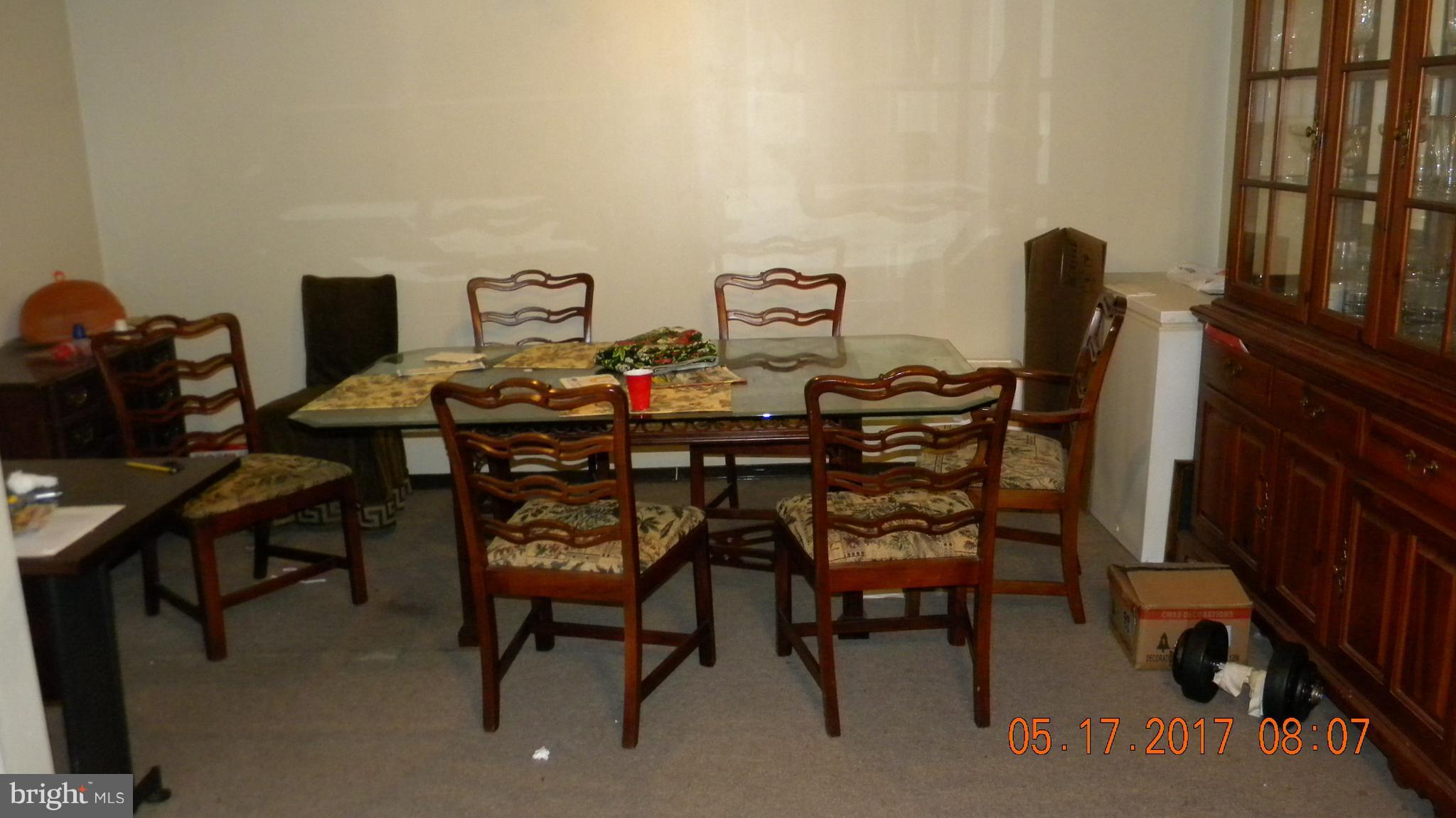 917 Prestwood Road Baltimore, MD 21228 - Photo 7 of 18 a view of a dining room with furniture and wooden floor