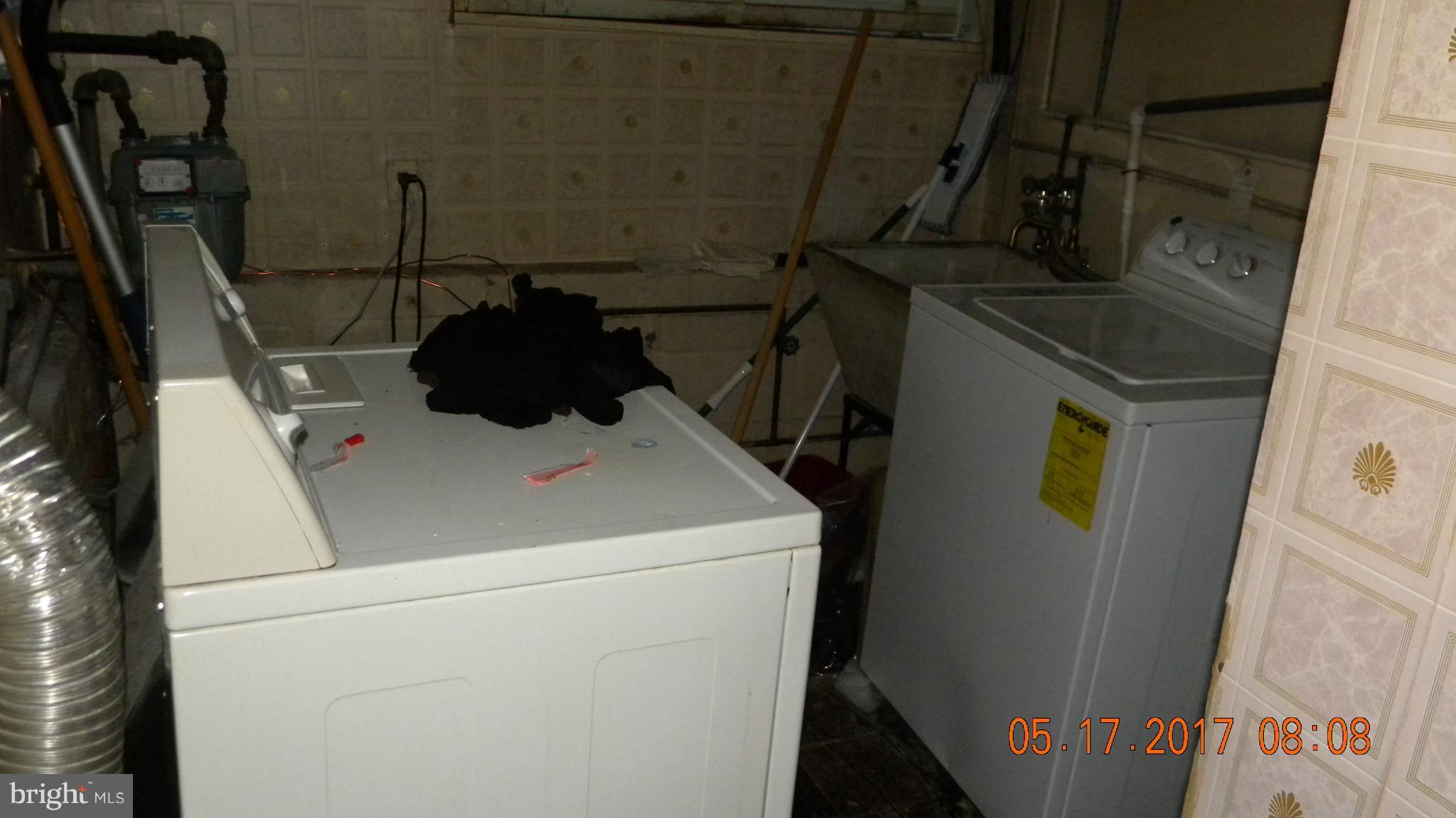 917 Prestwood Road Baltimore, MD 21228 - Photo 10 of 18 a close up of a washer and dryer