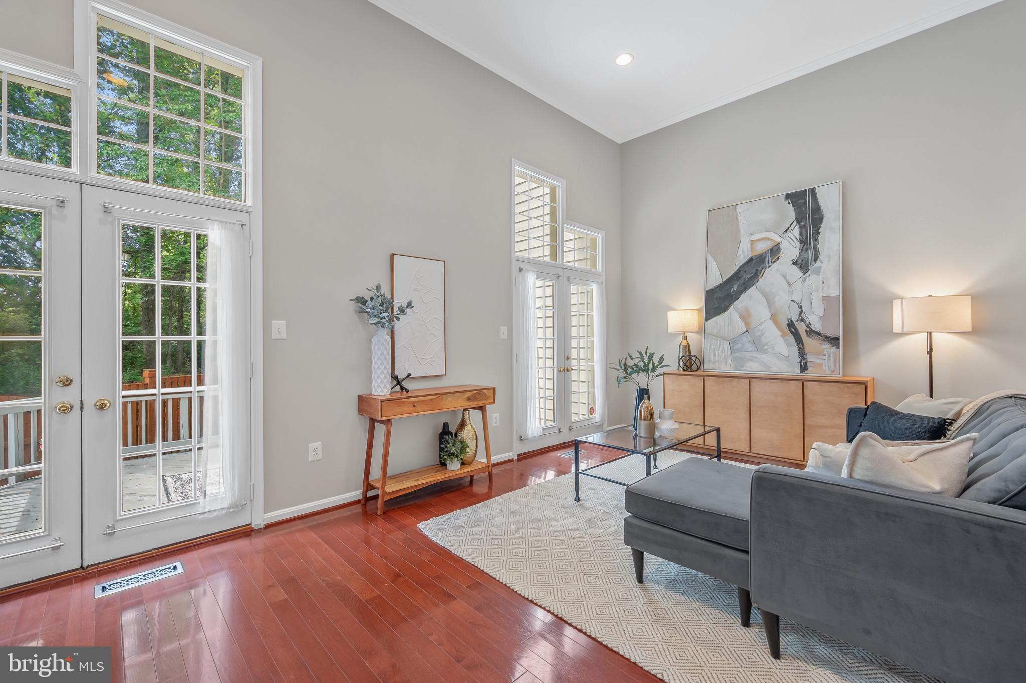 1242 Weatherstone Court Reston, VA 20194 - Photo 11 of 40 a living room with furniture and a table