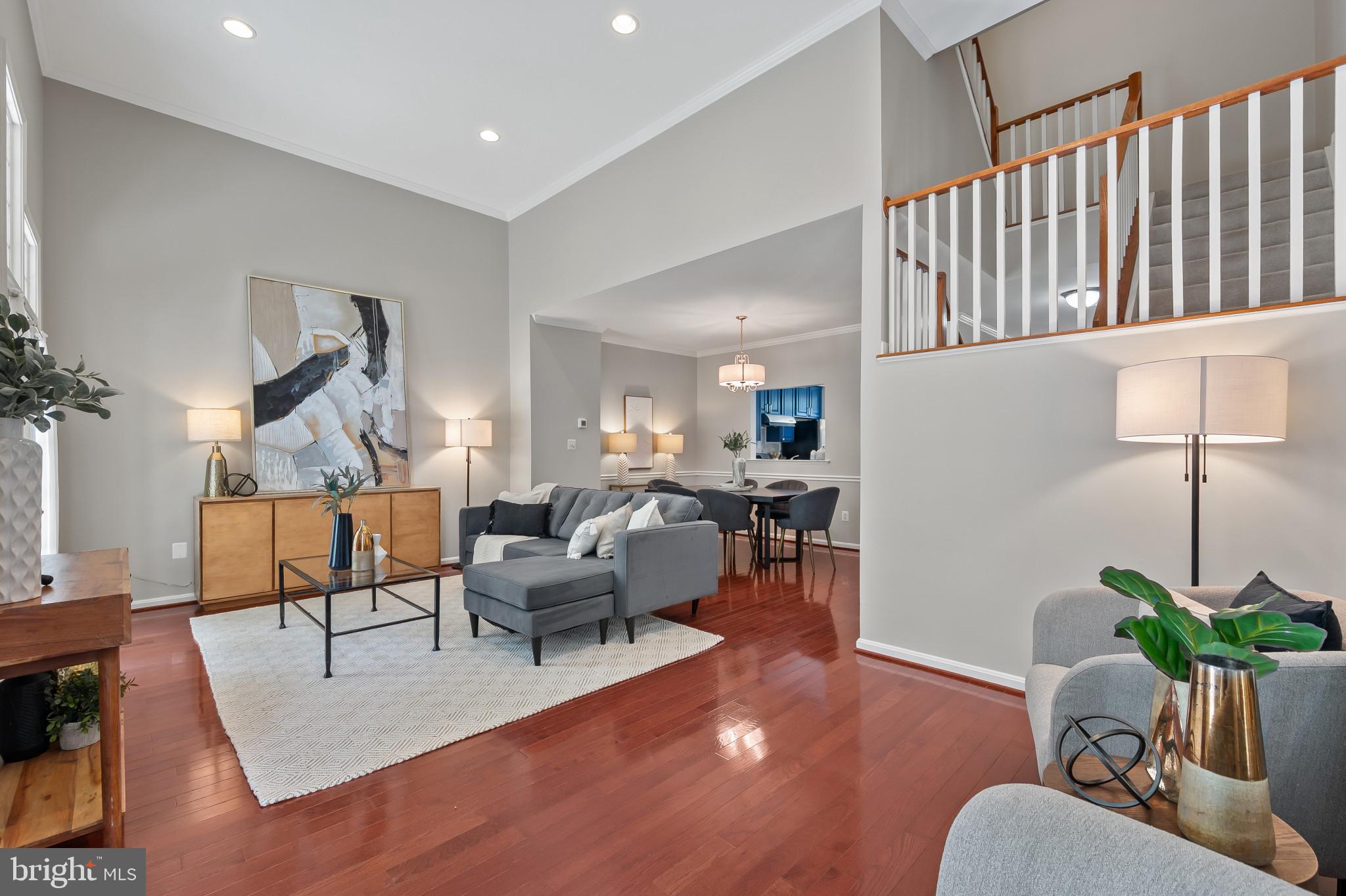 1242 Weatherstone Court Reston, VA 20194 - Photo 12 of 40 a living room with furniture potted plant and a wooden floor