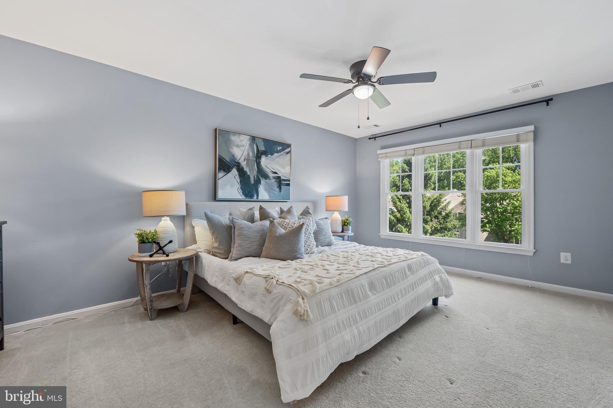 1242 Weatherstone Court Reston, VA 20194 - Photo 16 of 40 a bedroom with a bed and window