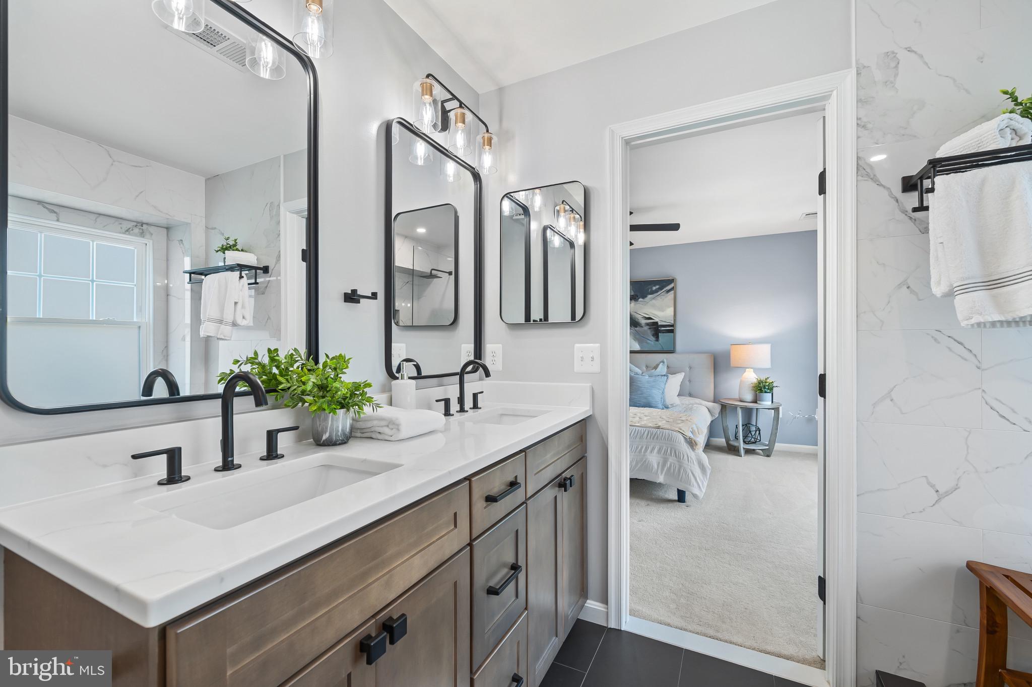 1242 Weatherstone Court Reston, VA 20194 - Photo 20 of 40 a bathroom with a sink and a mirror