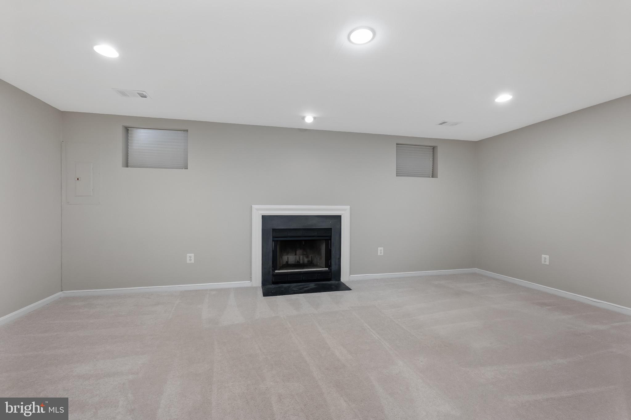 1242 Weatherstone Court Reston, VA 20194 - Photo 29 of 40 an empty room with a fireplace