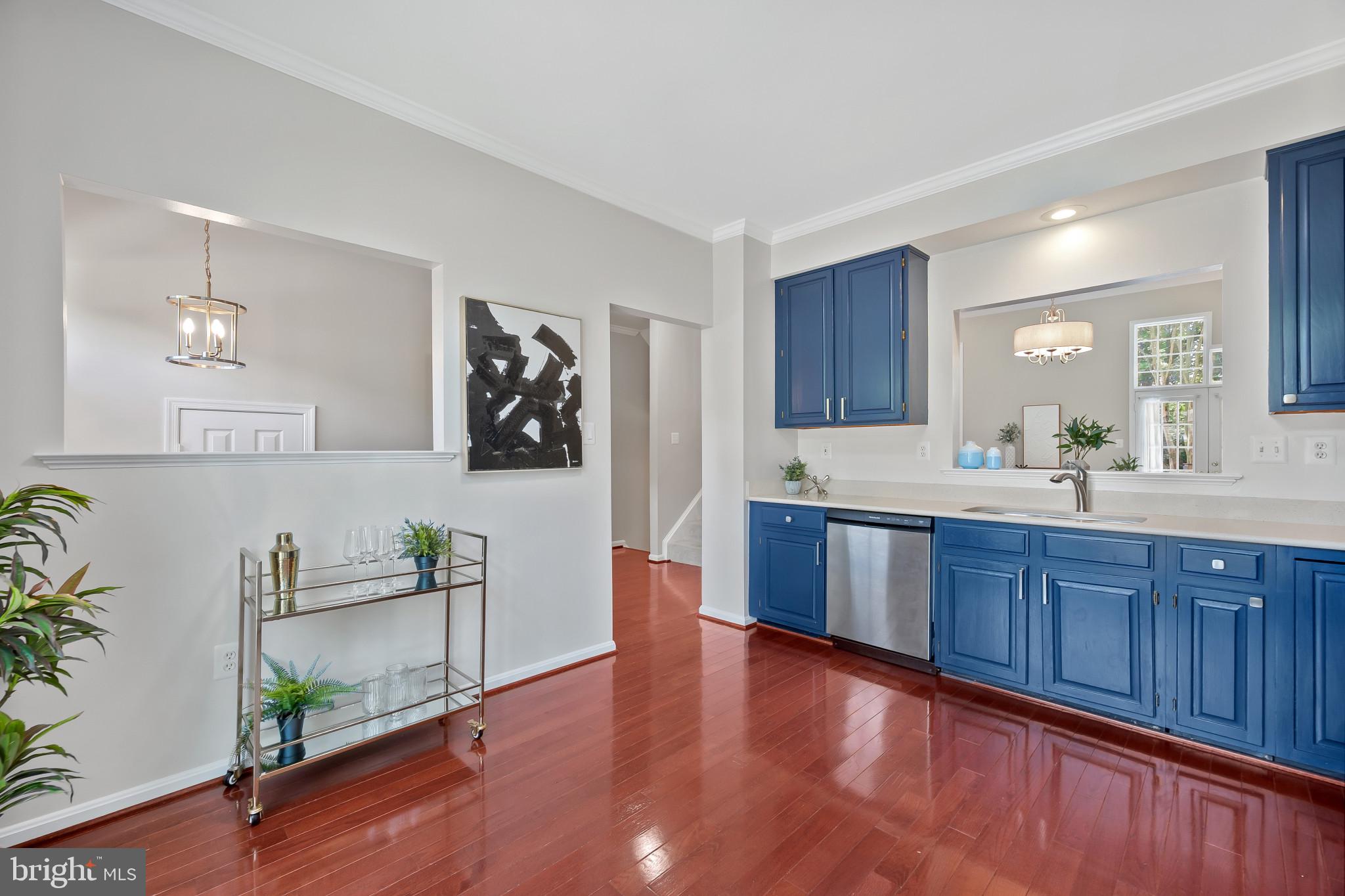 1242 Weatherstone Court Reston, VA 20194 - Photo 8 of 40 a large kitchen with wooden floor and stainless steel appliances