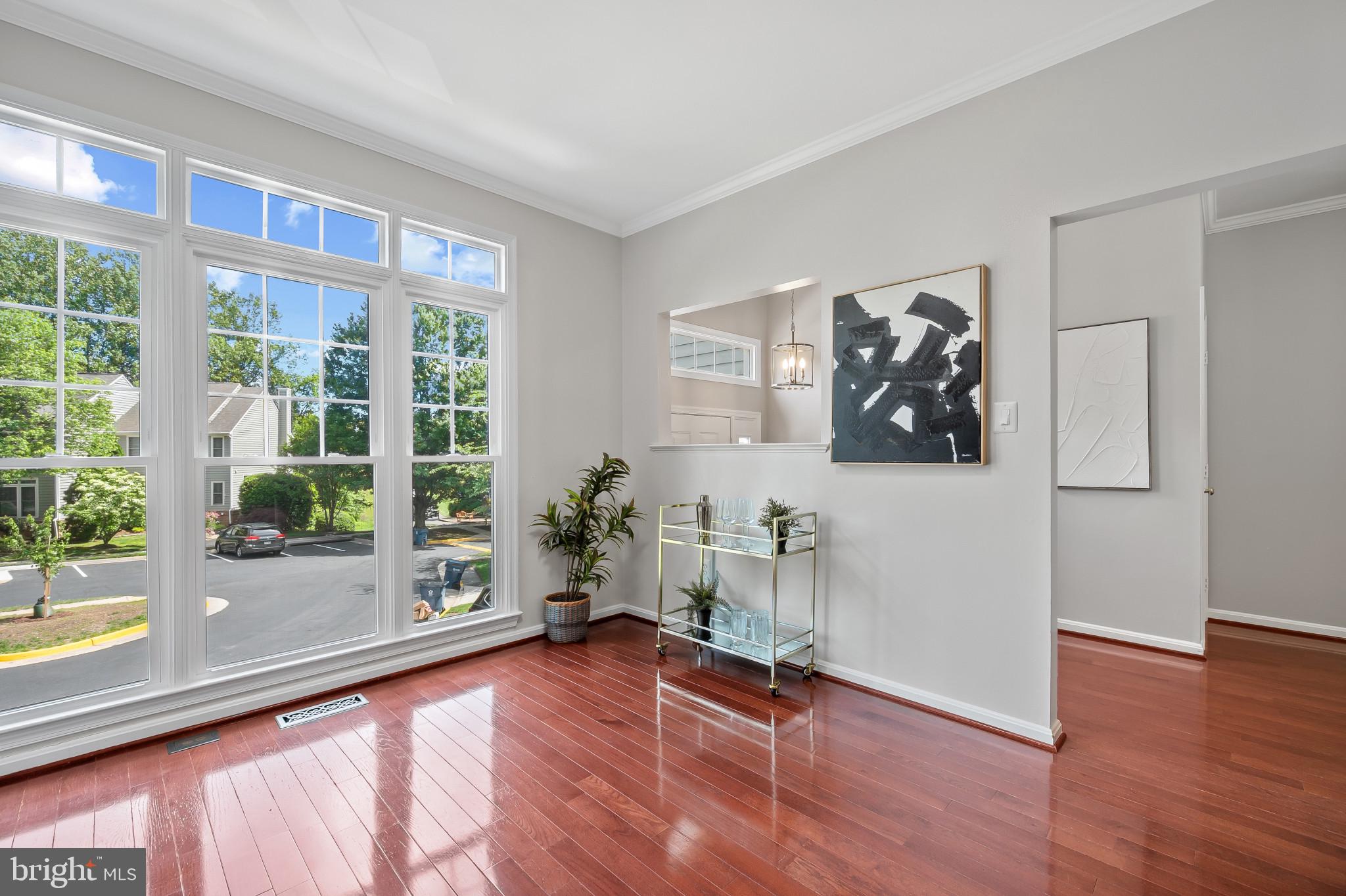1242 Weatherstone Court Reston, VA 20194 - Photo 9 of 40 a view of a livingroom with wooden floor and furniture