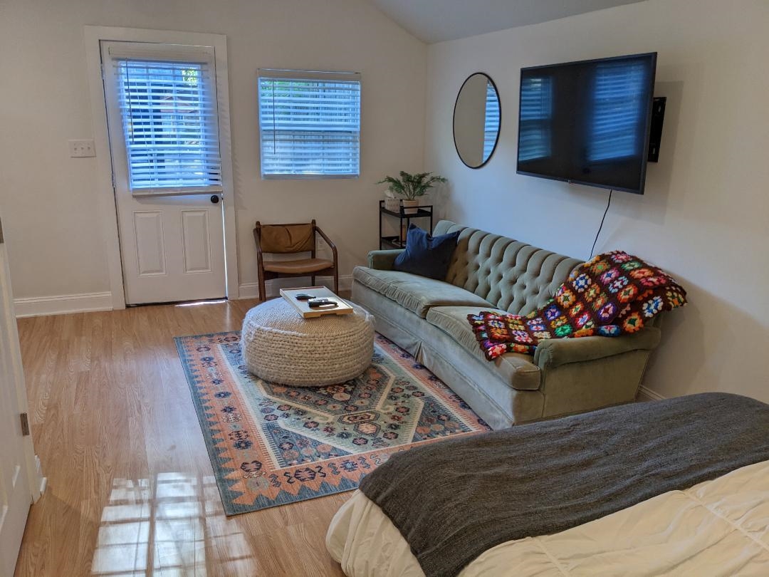 1044 Bruce Street Memphis, TN 38104 - Photo 32 of 34 a living room with furniture and a flat screen tv