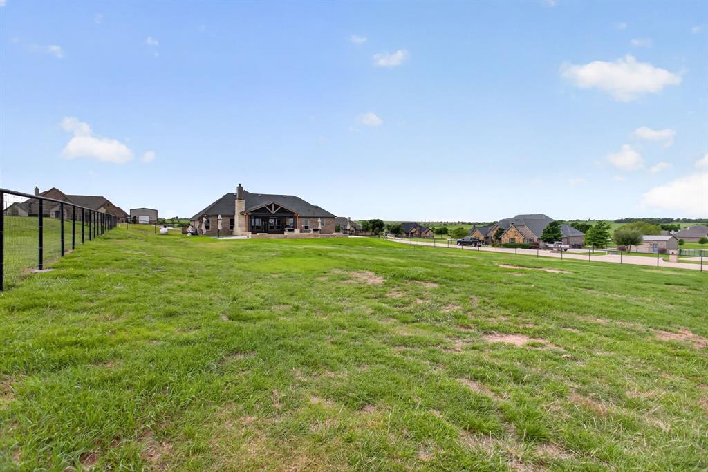7320 Spring Ranch Court Godley, TX 76044 - Photo 29 of 38 a view of a green field with clear sky