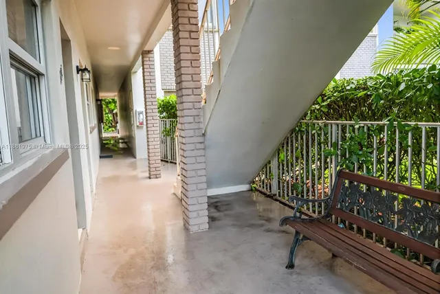 a view of balcony with wooden floor