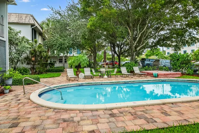 a view of a swimming pool with a patio