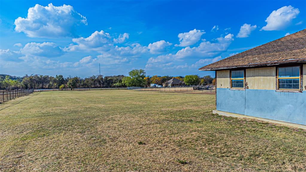 2121 Rock Creek Road Crowley, TX 76036 - Photo 20 of 22 a view of a house with a yard