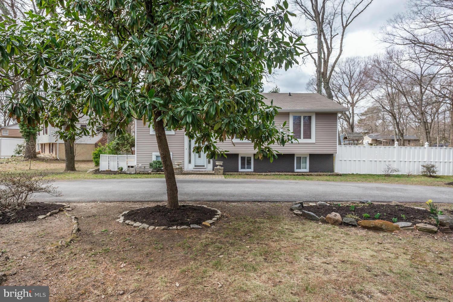 256 Magothy Bridge Road Pasadena, MD 21122 - Photo 1 of 24 a front view of a house with a yard