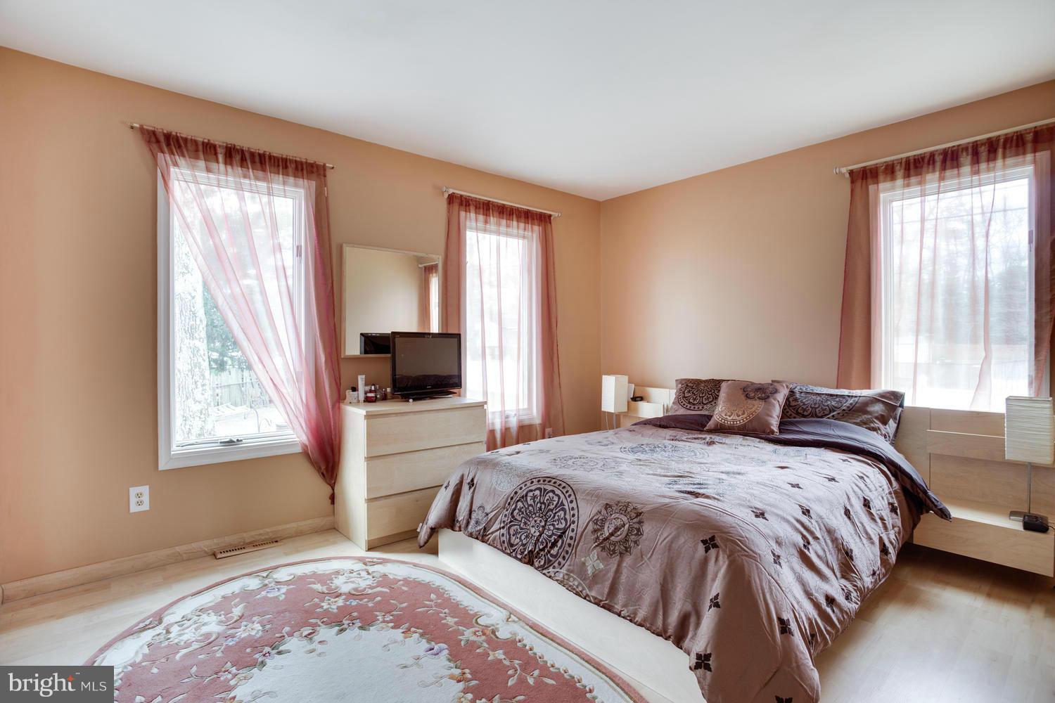 256 Magothy Bridge Road Pasadena, MD 21122 - Photo 12 of 24 a bedroom with a bed and a window