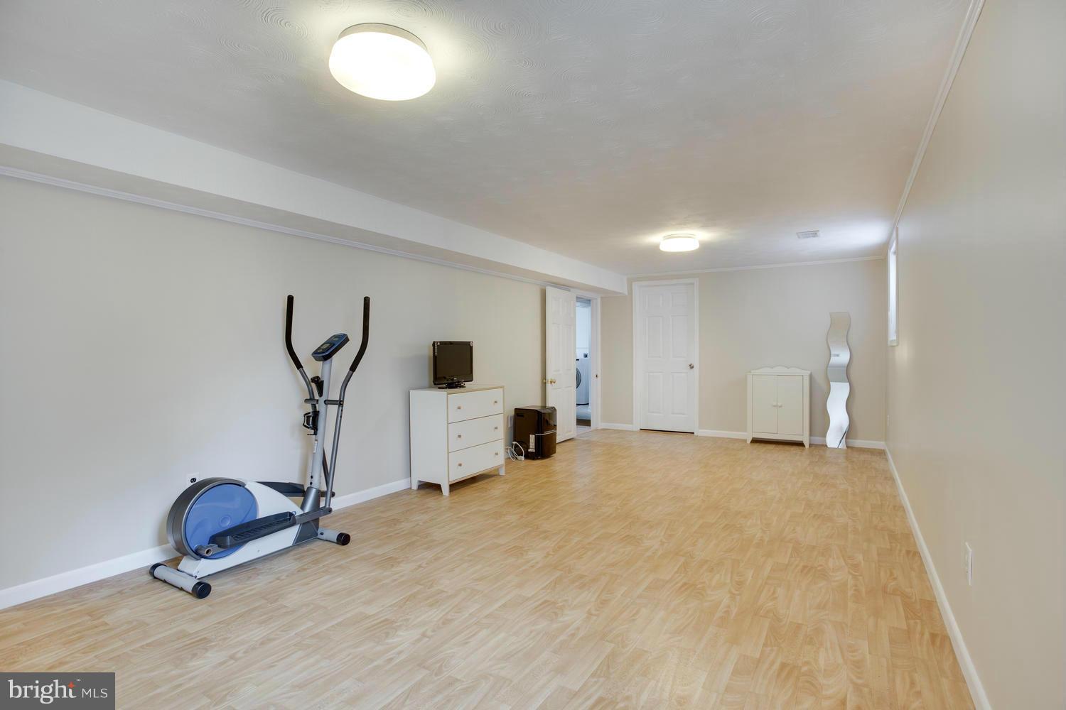256 Magothy Bridge Road Pasadena, MD 21122 - Photo 17 of 24 a view of a room with gym equipment