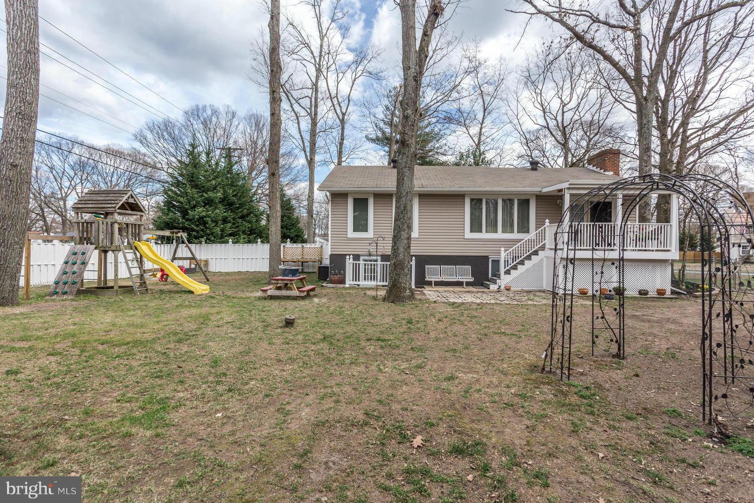 256 Magothy Bridge Road Pasadena, MD 21122 - Photo 22 of 24 a view of a house with a yard and sitting area