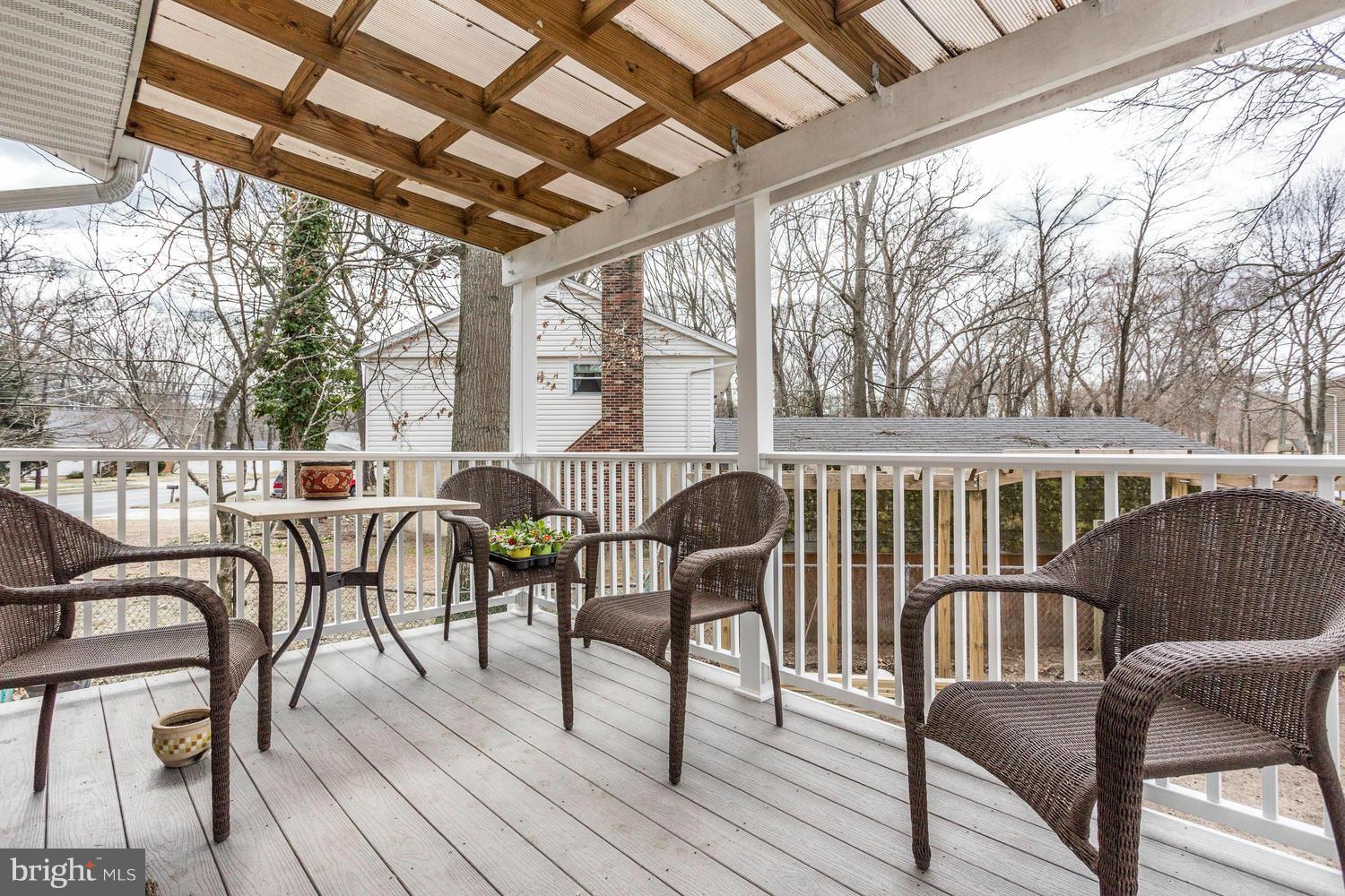 256 Magothy Bridge Road Pasadena, MD 21122 - Photo 23 of 24 a view of a patio with glass top table and chairs