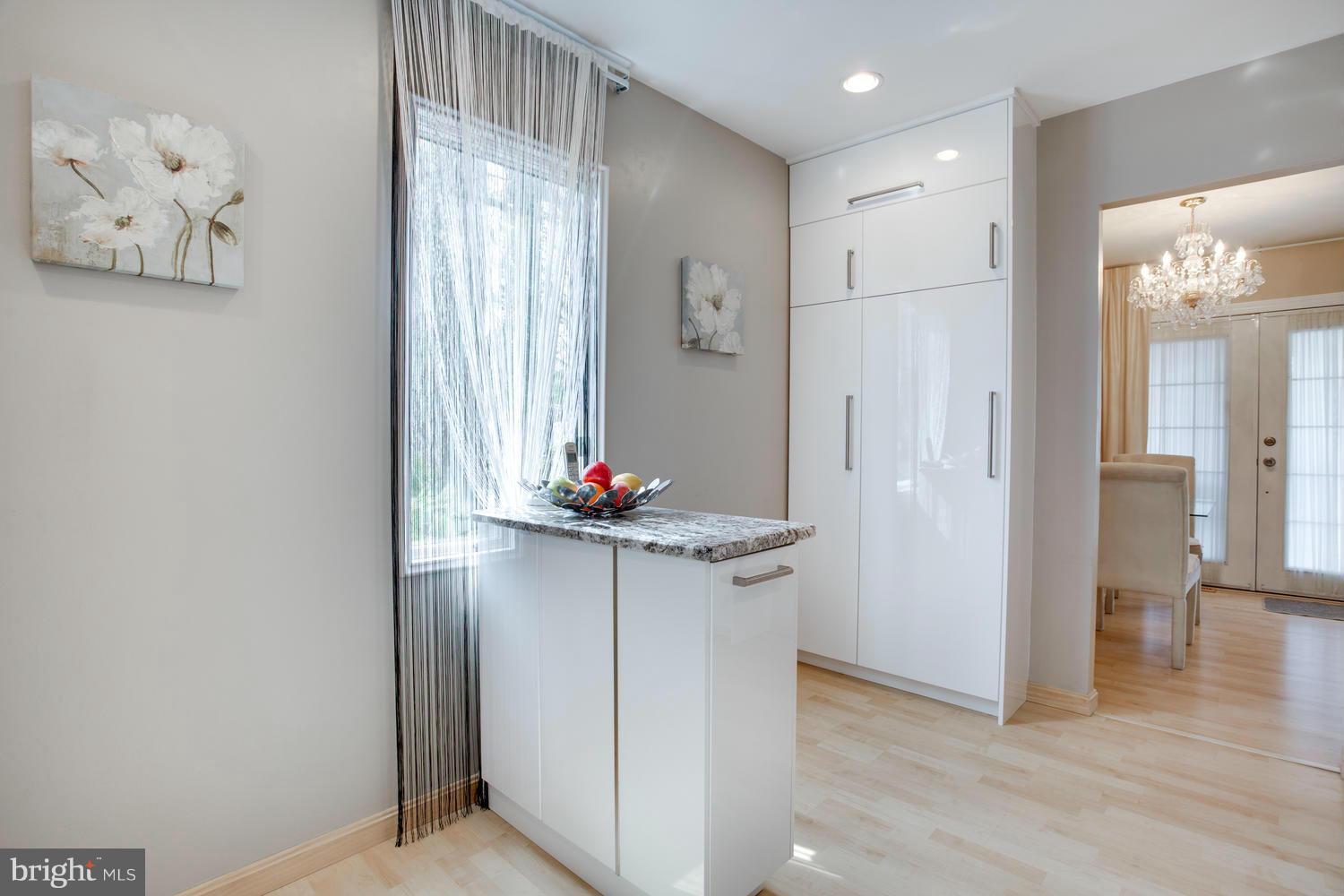256 Magothy Bridge Road Pasadena, MD 21122 - Photo 7 of 24 a view of kitchen with furniture and wooden floor