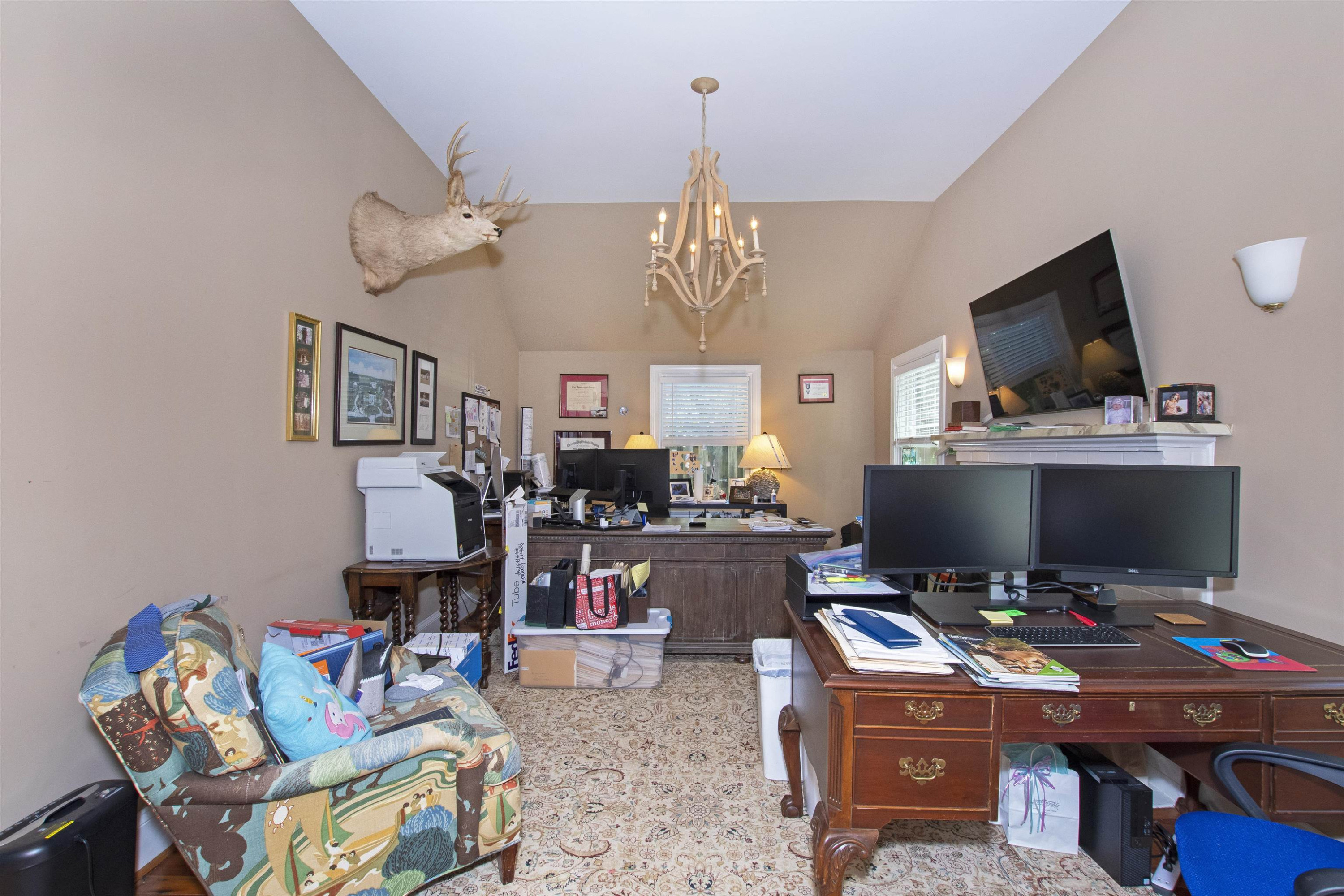 2610 Dover Road Raleigh, NC 27608 - Photo 18 of 20 a view of a workspace with furniture and a flat screen tv