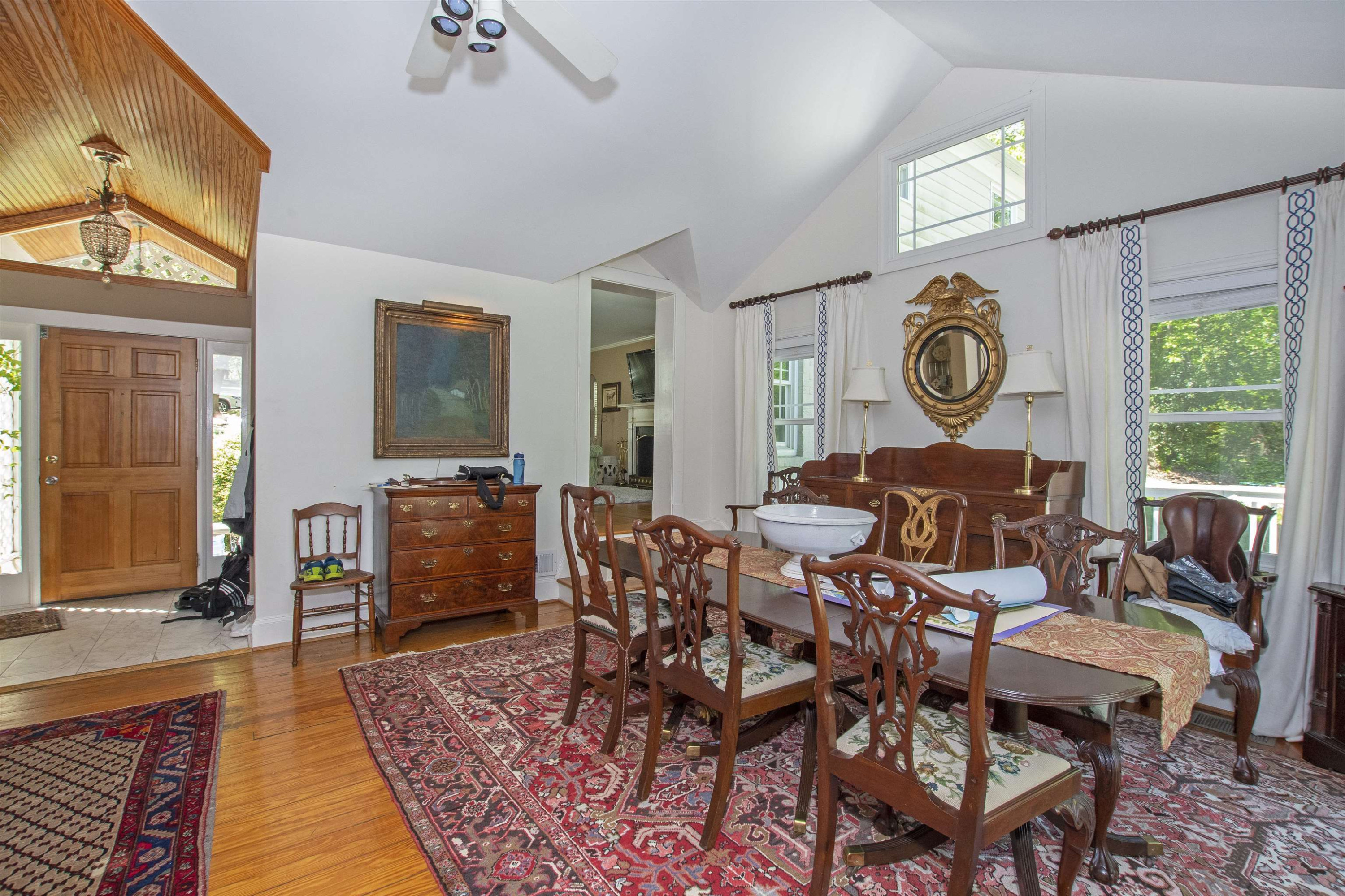 2610 Dover Road Raleigh, NC 27608 - Photo 8 of 20 a living room with furniture a clock on wall and a window