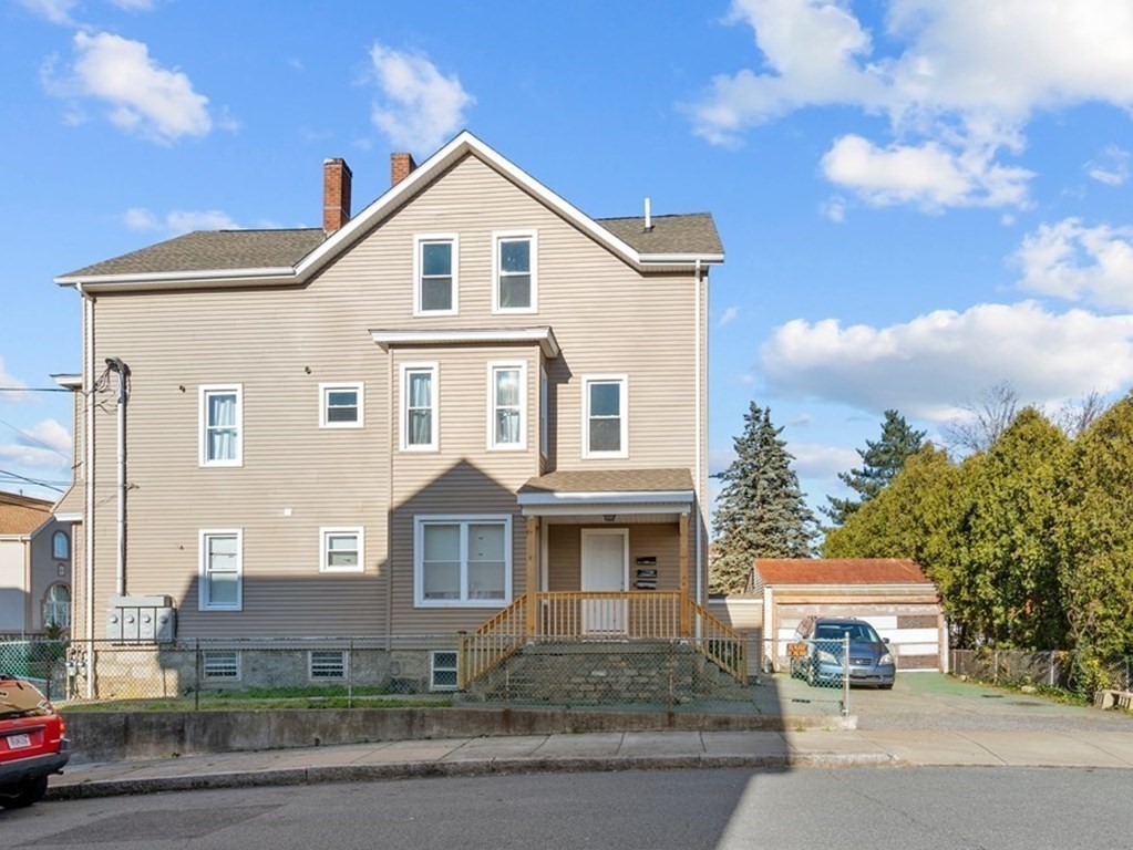 42 Mott Street Fall River, MA 02721 - Photo 1 of 36 a front view of a house with a garden