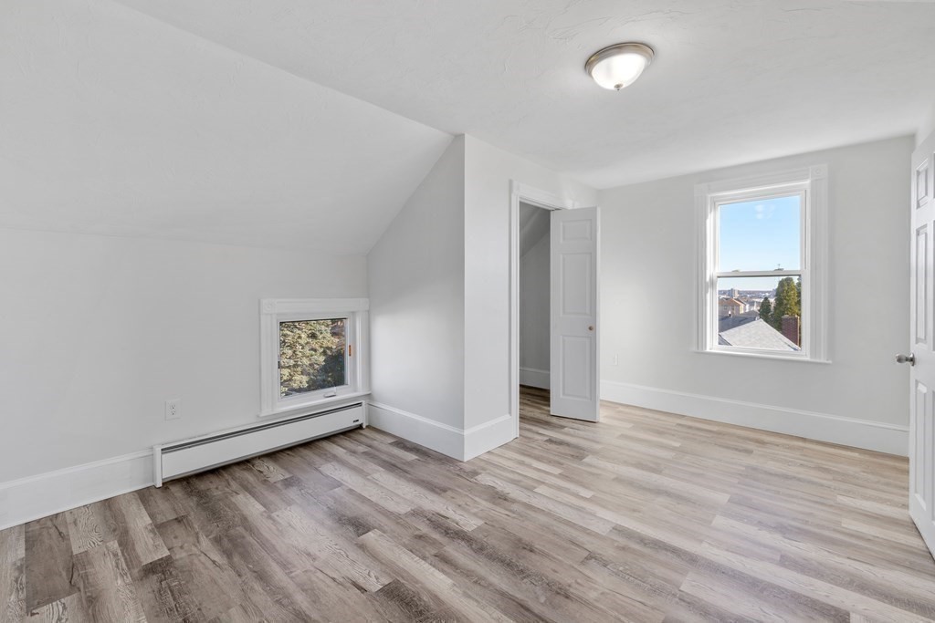42 Mott Street Fall River, MA 02721 - Photo 11 of 36 a view of an empty room with wooden floor and a window