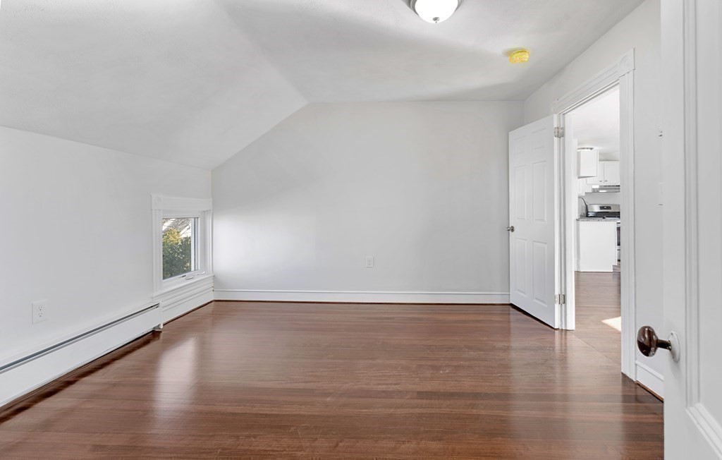 42 Mott Street Fall River, MA 02721 - Photo 13 of 36 an empty room with wooden floor and windows
