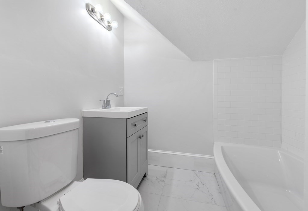 42 Mott Street Fall River, MA 02721 - Photo 15 of 36 a bathroom with a sink toilet and shower