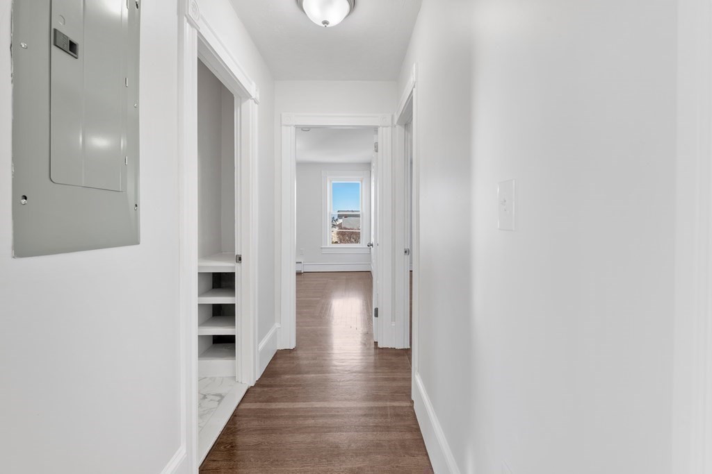 42 Mott Street Fall River, MA 02721 - Photo 17 of 36 a view of a hallway with wooden floor and staircase