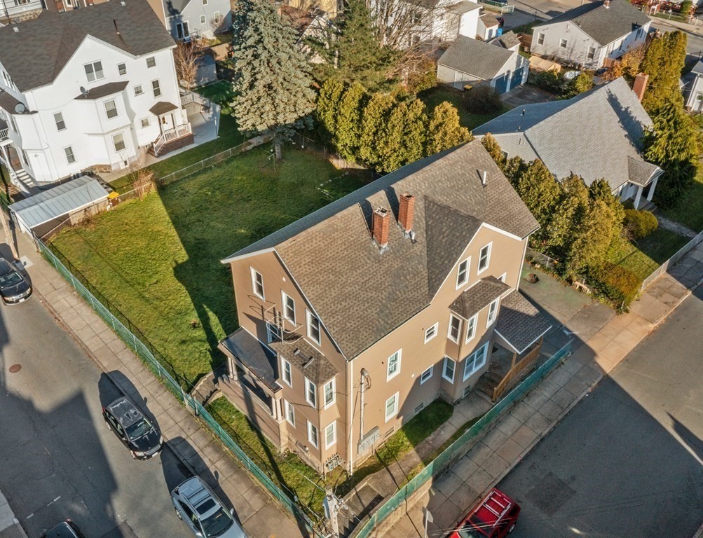 42 Mott Street Fall River, MA 02721 - Photo 2 of 36 an aerial view of a house with a yard