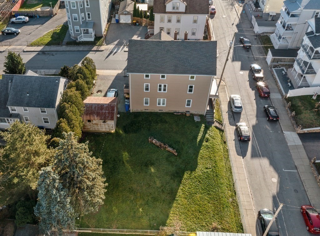 42 Mott Street Fall River, MA 02721 - Photo 24 of 36 an aerial view of a house with a garden and pool