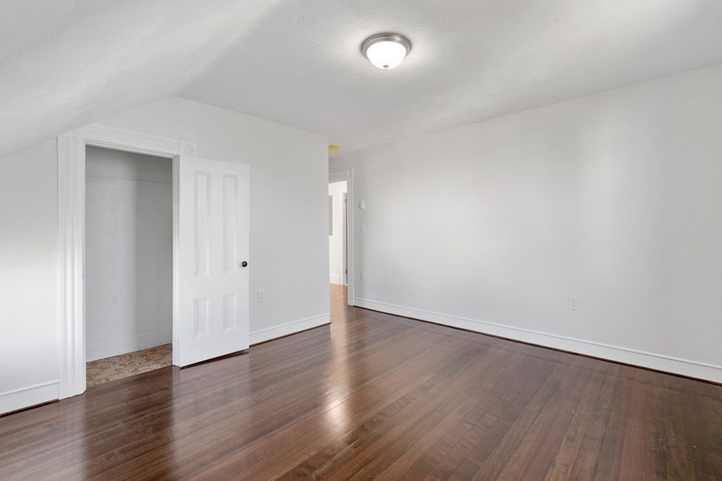 42 Mott Street Fall River, MA 02721 - Photo 27 of 36 a view of an empty room with wooden floor
