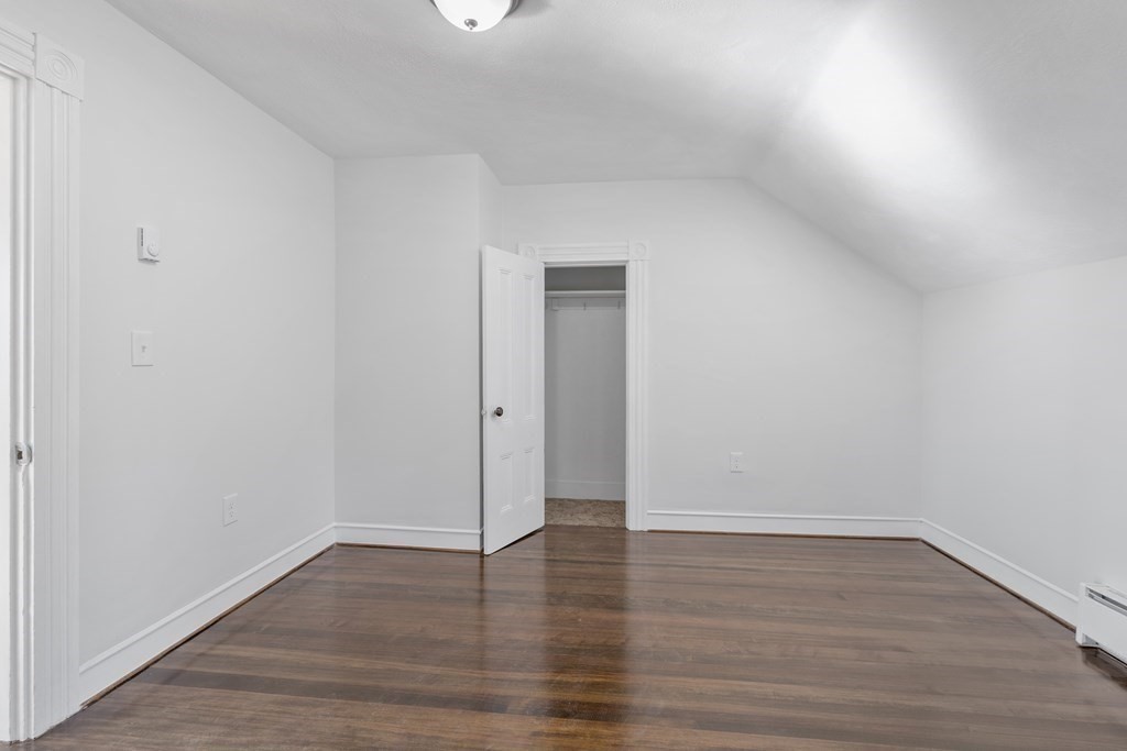42 Mott Street Fall River, MA 02721 - Photo 30 of 36 a view of an empty room with wooden floor