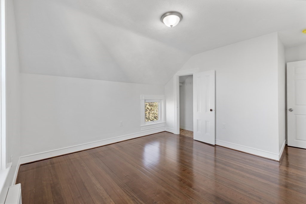 42 Mott Street Fall River, MA 02721 - Photo 31 of 36 an empty room with wooden floor and windows
