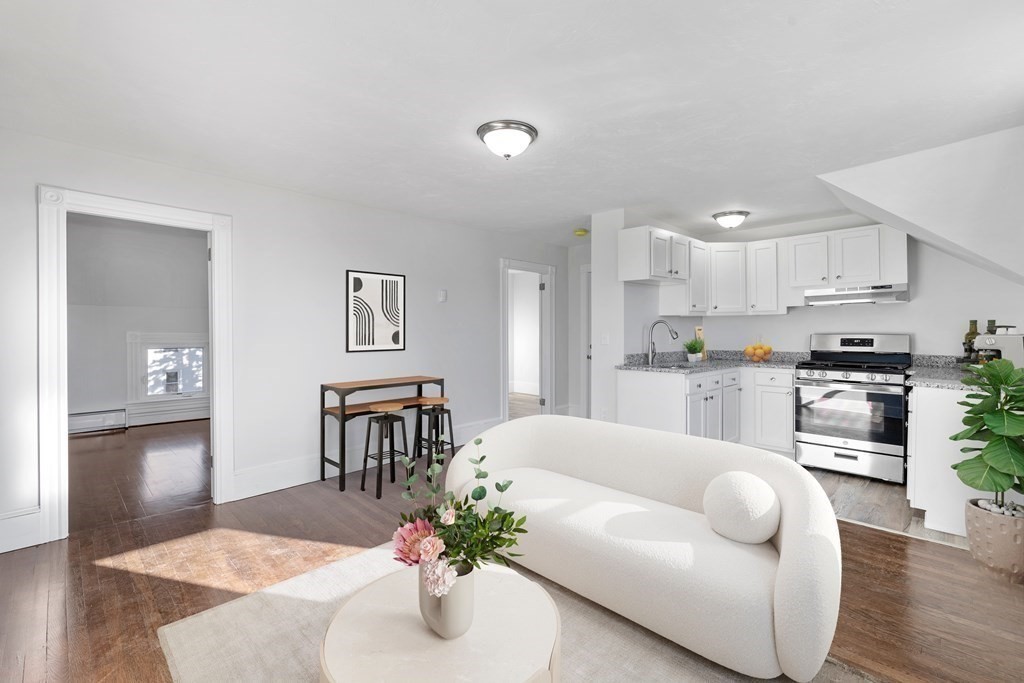 42 Mott Street Fall River, MA 02721 - Photo 5 of 36 a living room with furniture and kitchen view