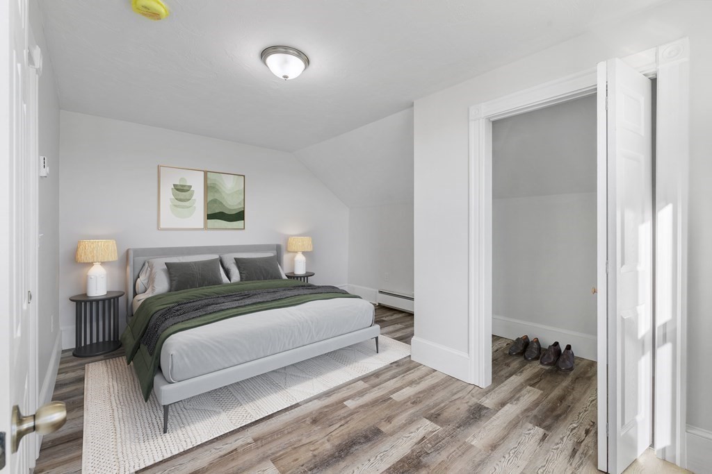 42 Mott Street Fall River, MA 02721 - Photo 6 of 36 a bedroom with a bed and a painting on the wall