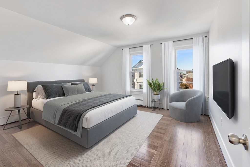 42 Mott Street Fall River, MA 02721 - Photo 7 of 36 a spacious bedroom with a bed and a couch