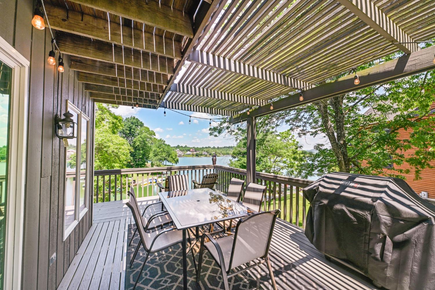 1236 Monteray Circle Lawrenceburg, IN 47025 - Photo 20 of 66 Large deck that wraps around from the side to the back, partially shaded with year round views of the lake.