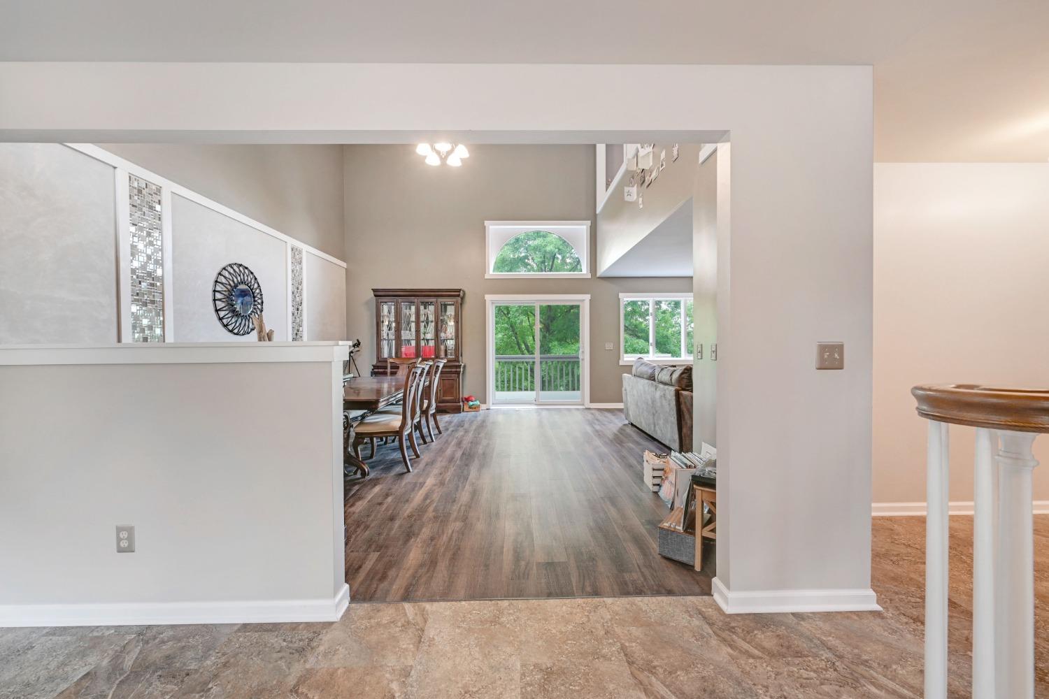 1236 Monteray Circle Lawrenceburg, IN 47025 - Photo 24 of 66 Open concept first floor with towering ceilings, formal dining, large living room with fireplace, spacious updated eat-in kitchen with walkout to back deck, large family room with cathedral ceilings, first floor laundry/mudroom, half bath, and first floor master bedroom and adjoining master suite