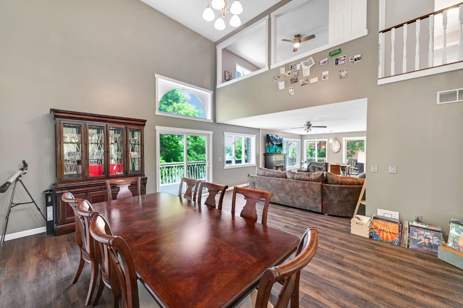 1236 Monteray Circle Lawrenceburg, IN 47025 - Photo 28 of 66 Open concept first floor with towering ceilings, formal dining, large living room with fireplace, spacious updated eat-in kitchen with walkout to back deck, large family room with cathedral ceilings, first floor laundry/mudroom, half bath, and first floor master bedroom and adjoining master suite