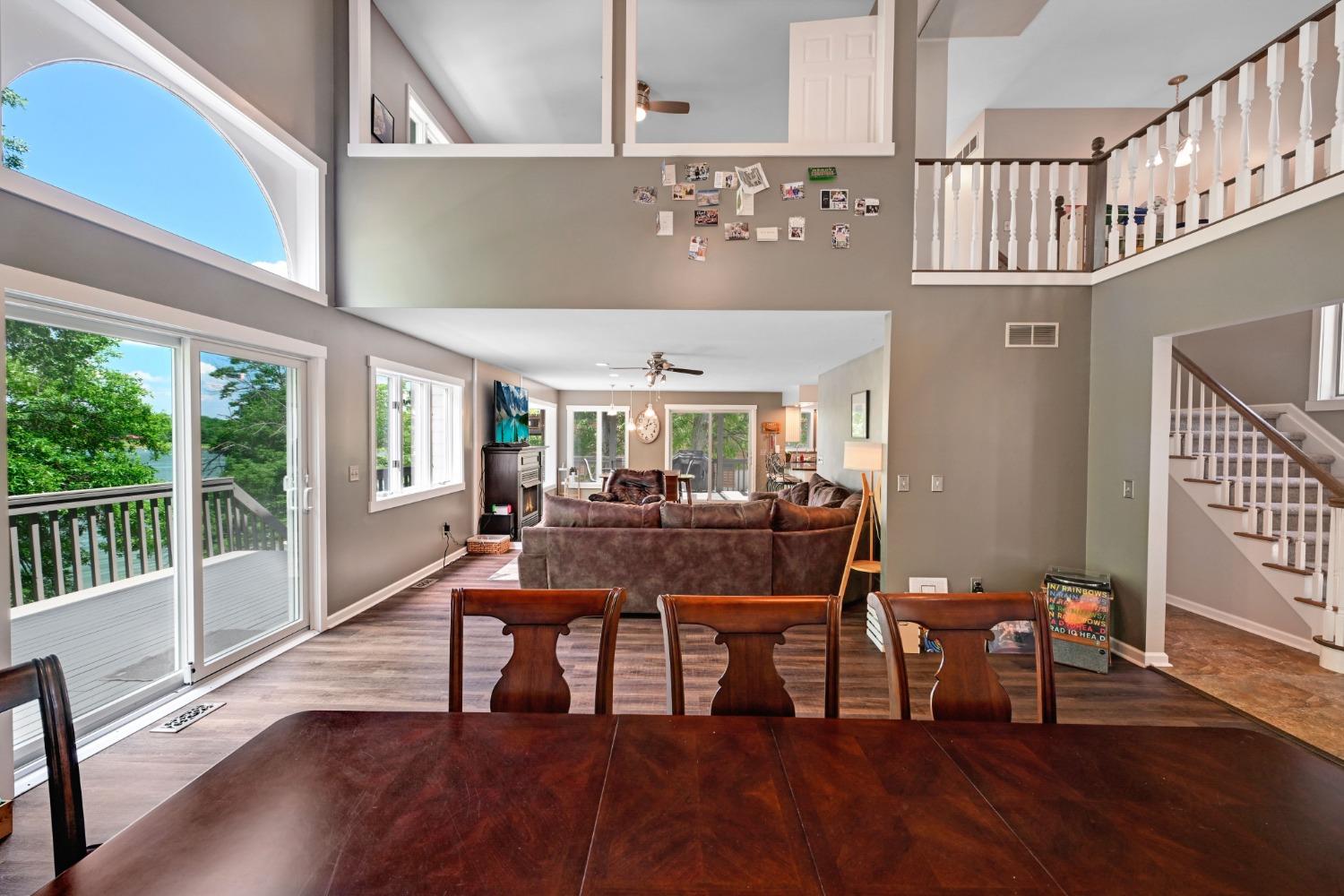 1236 Monteray Circle Lawrenceburg, IN 47025 - Photo 29 of 66 Open concept first floor with towering ceilings, formal dining, large living room with fireplace, spacious updated eat-in kitchen with walkout to back deck, large family room with cathedral ceilings, first floor laundry/mudroom, half bath, and first floor master bedroom and adjoining master suite