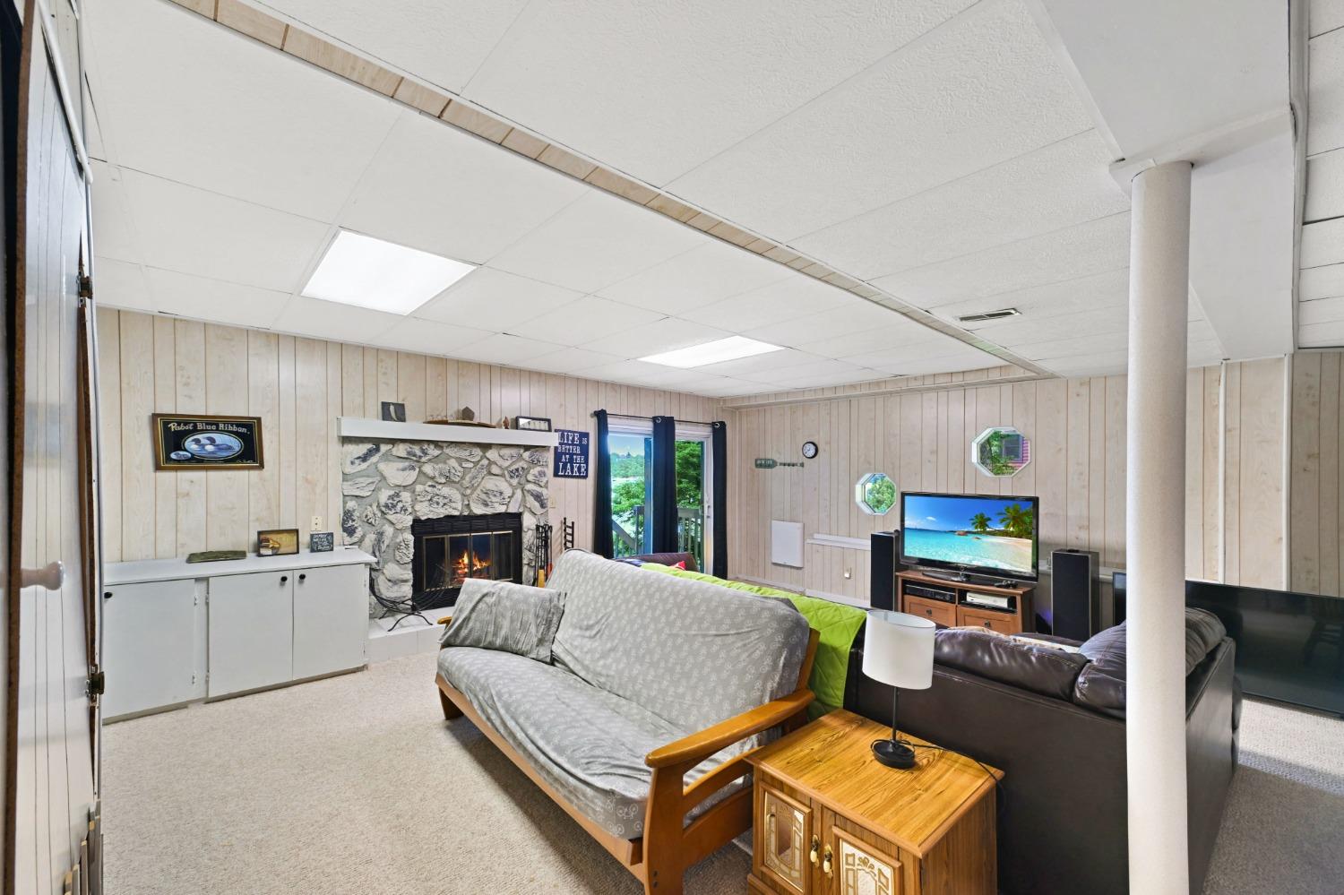 1236 Monteray Circle Lawrenceburg, IN 47025 - Photo 53 of 66 Lower level family room with fireplace and walk-out to back deck!