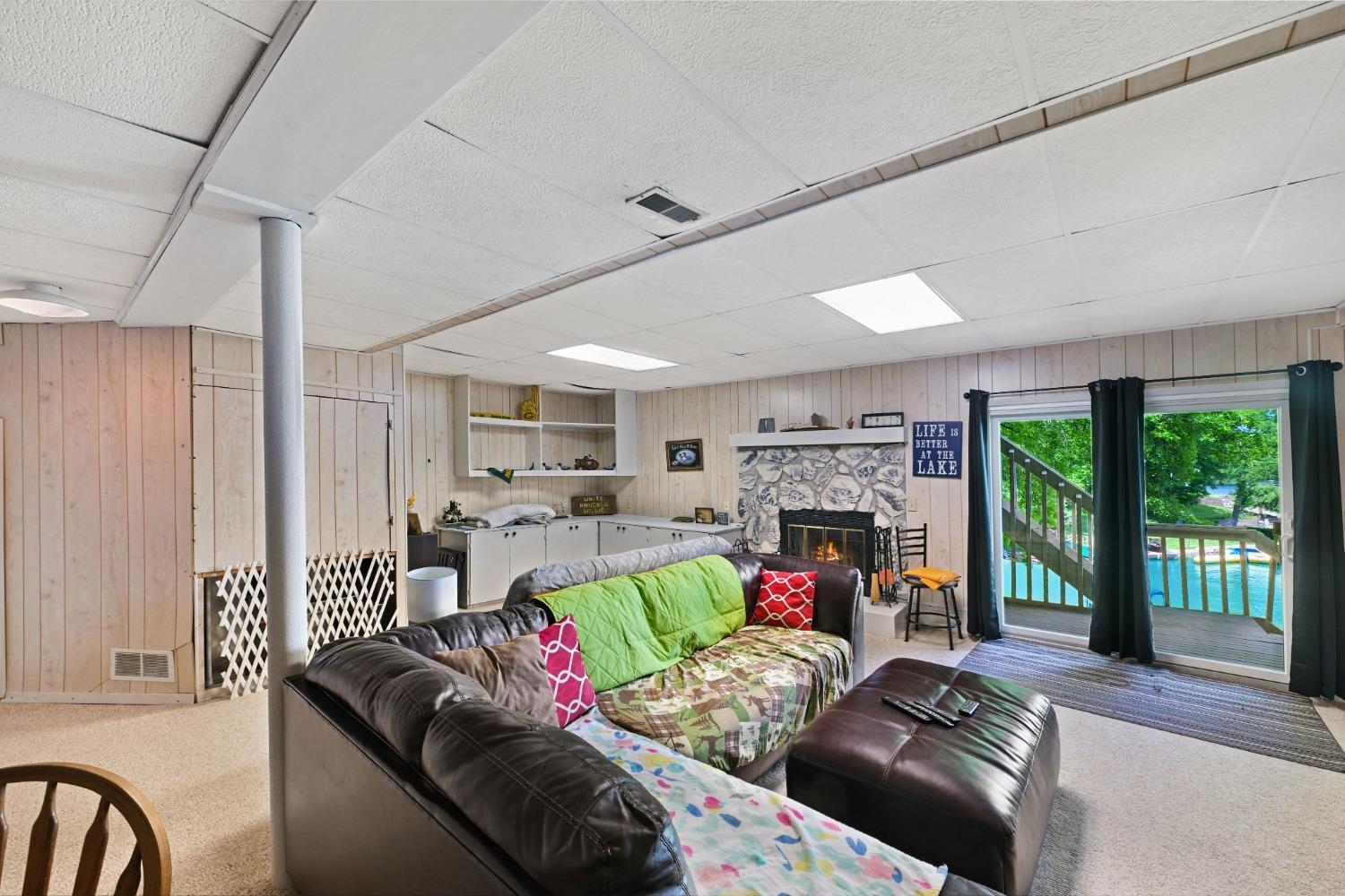 1236 Monteray Circle Lawrenceburg, IN 47025 - Photo 54 of 66 Lower level family room with fireplace and walk-out to back deck!