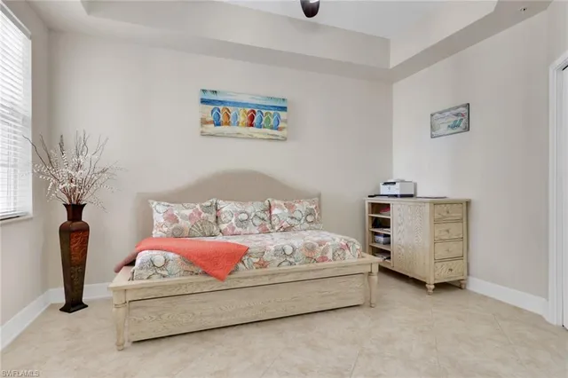 a bedroom with a bed and a chair