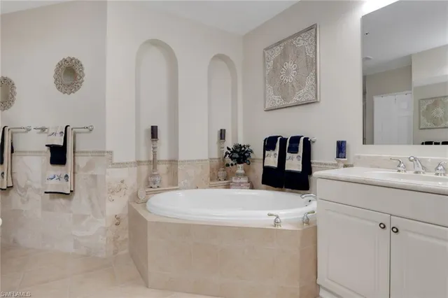 a bathroom with a double vanity sink and mirror