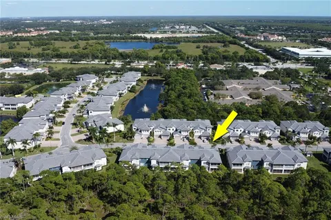 an aerial view of a house with a lake view