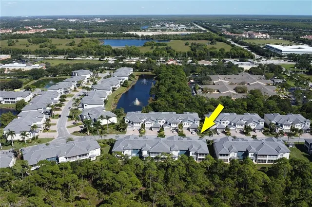 an aerial view of a house with a lake view
