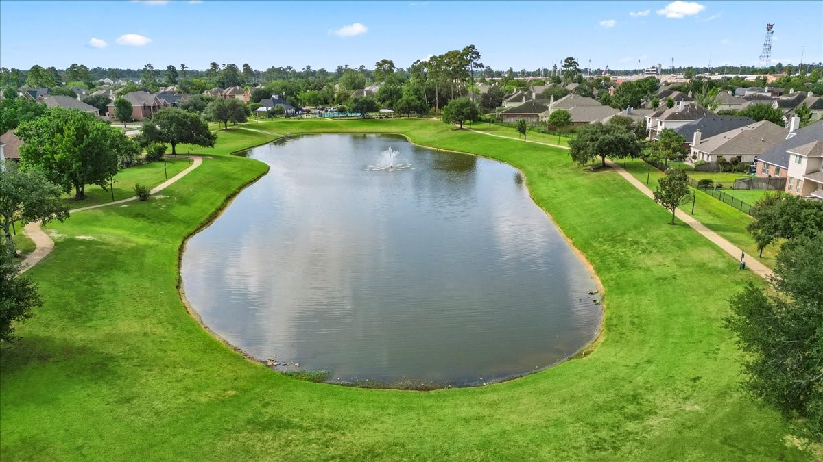 527 Cypresswood Knoll Spring, TX 77373 - Photo 11 of 45 an aerial view of a house with a yard and lake